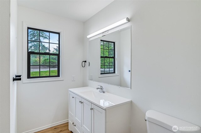 13428 SE 302nd Pl, Auburn, WA 98092 - half bath featuring vanity and wood finished floors