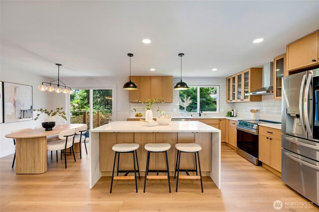 20126 81st Ave W, Edmonds, WA 98026 - kitchen with stainless steel appliances, wall chimney exhaust hood, backsplash, a center island, and recessed lighting
