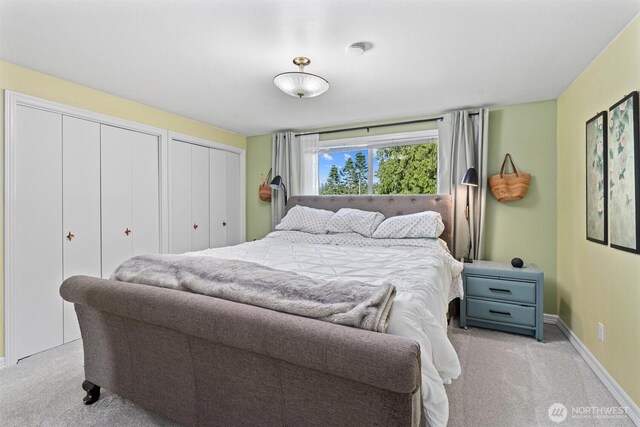 809 W Rocky Point Dr, Camano Island, WA 98282 - bedroom featuring light carpet and two closets