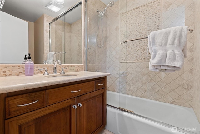 809 W Rocky Point Dr, Camano Island, WA 98282 - bathroom featuring vanity, combined bath / shower with glass door, and backsplash
