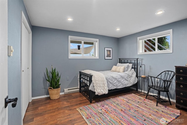 809 W Rocky Point Dr, Camano Island, WA 98282 - bedroom with a baseboard heating unit, wood finished floors, multiple windows, and recessed lighting