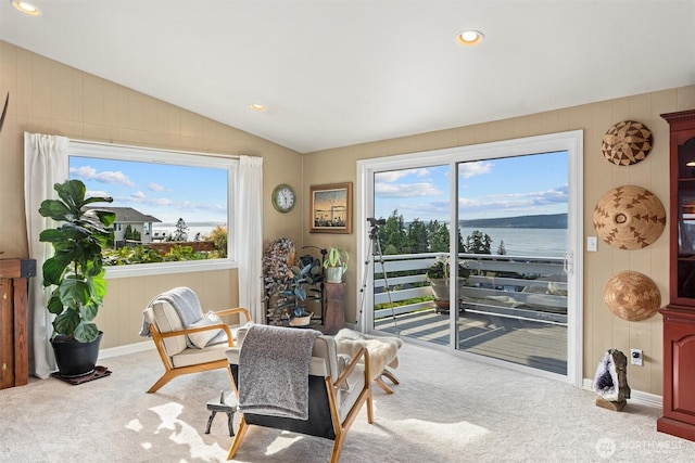 809 W Rocky Point Dr, Camano Island, WA 98282 - dining space with lofted ceiling, carpet, healthy amount of natural light, a water view, and wood walls
