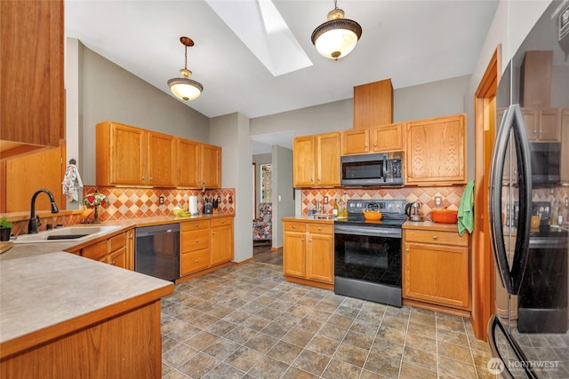 5626 Thane Ln SE, Port Orchard, WA 98367 - kitchen featuring stainless steel appliances, a skylight, decorative backsplash, and light countertops