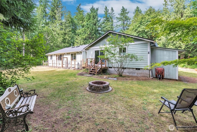 5626 Thane Ln SE, Port Orchard, WA 98367 - back of house with crawl space, a fire pit, and a yard