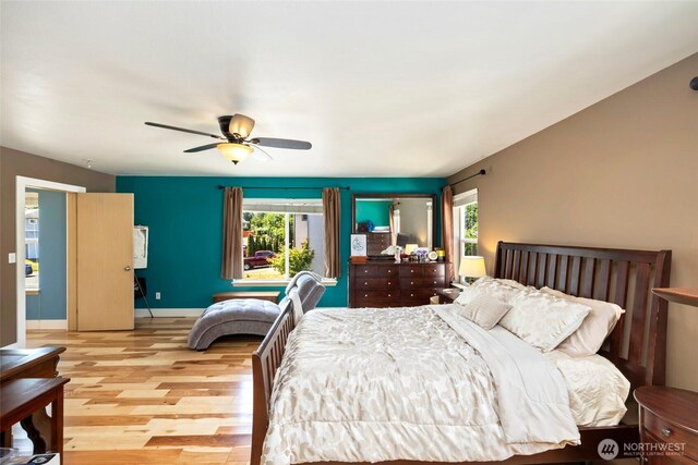 29745 214th Ave SE, Kent, WA 98042 - bedroom featuring wood finished floors, multiple windows, and a ceiling fan