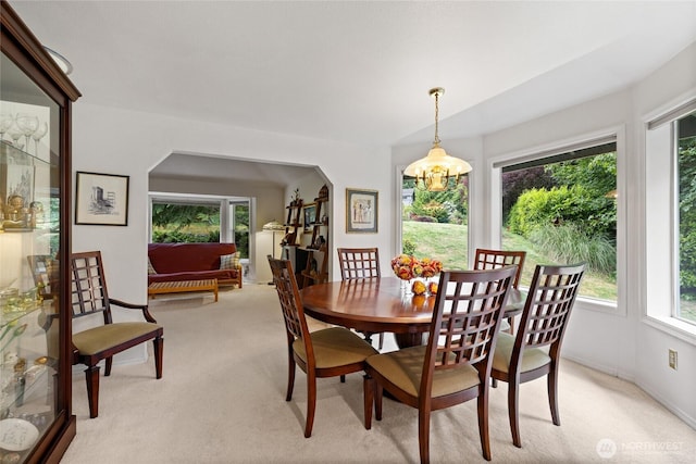 6345 Agnes Rd NE, Tacoma, WA 98422 - dining area with light colored carpet and a chandelier