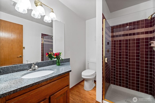 6345 Agnes Rd NE, Tacoma, WA 98422 - bathroom featuring a stall shower, vanity, wood finished floors, and a chandelier