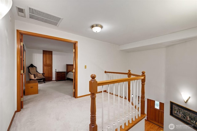 6345 Agnes Rd NE, Tacoma, WA 98422 - hallway with an upstairs landing and light colored carpet