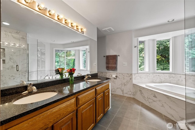 6345 Agnes Rd NE, Tacoma, WA 98422 - bathroom with a bath, tile patterned floors, double vanity, a marble finish shower, and a wainscoted wall