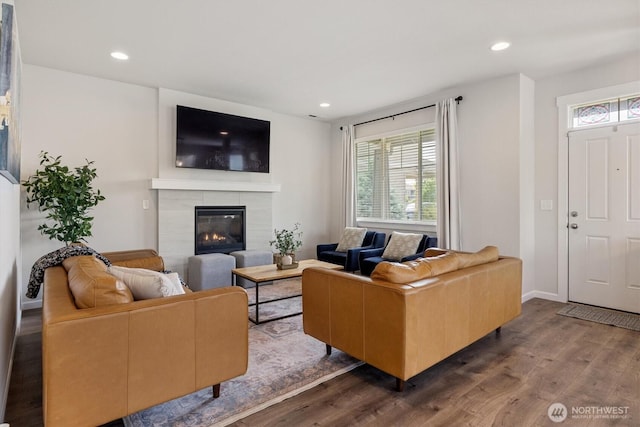 3119 13th Avenue Ct NW, Puyallup, WA 98371 - living room with wood finished floors, plenty of natural light, a tiled fireplace, and recessed lighting