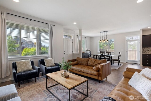 3119 13th Avenue Ct NW, Puyallup, WA 98371 - living room featuring light wood-type flooring, recessed lighting, and a chandelier