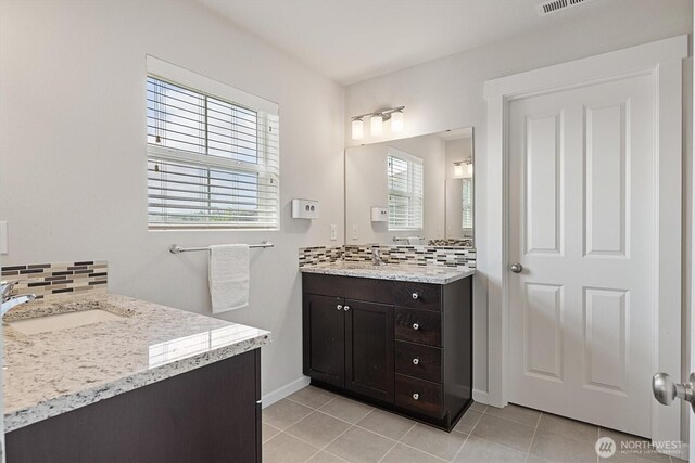 3119 13th Avenue Ct NW, Puyallup, WA 98371 - bathroom with tasteful backsplash, two vanities, and tile patterned flooring