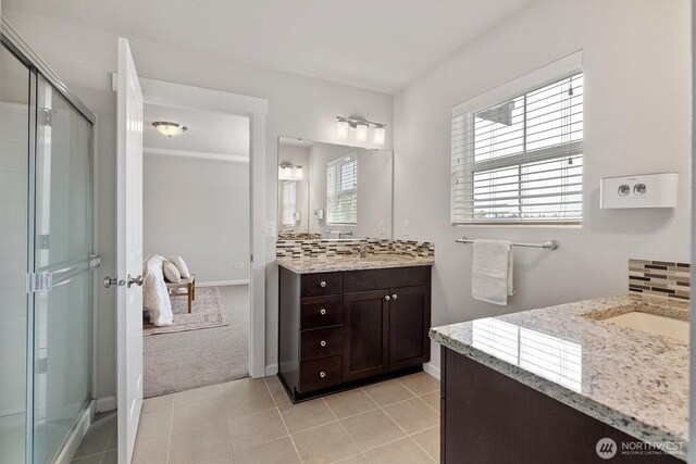 3119 13th Avenue Ct NW, Puyallup, WA 98371 - full bathroom with vanity, a shower stall, and tile patterned flooring