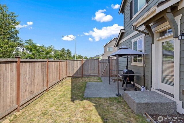 3119 13th Avenue Ct NW, Puyallup, WA 98371 - fenced backyard featuring a patio area, a gazebo, and a gate