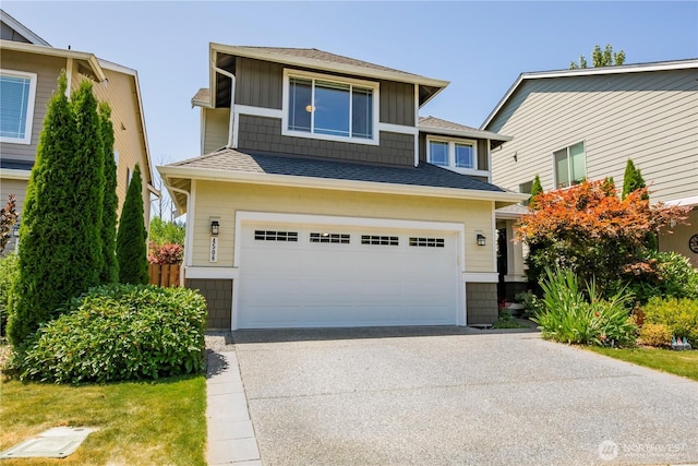 4508 29th Ave SE, Everett, WA 98203 - view of front of property with roof with shingles, driveway, an attached garage, and board and batten siding