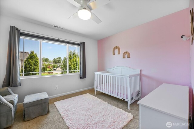4508 29th Ave SE, Everett, WA 98203 - carpeted bedroom with a crib and a ceiling fan