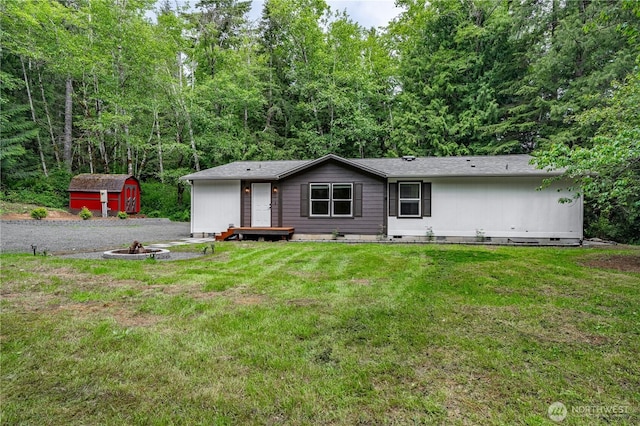 5279 SE Lars Hansen Rd, Port Orchard, WA 98367 - view of front of property featuring a storage unit, an outdoor fire pit, crawl space, and a front lawn