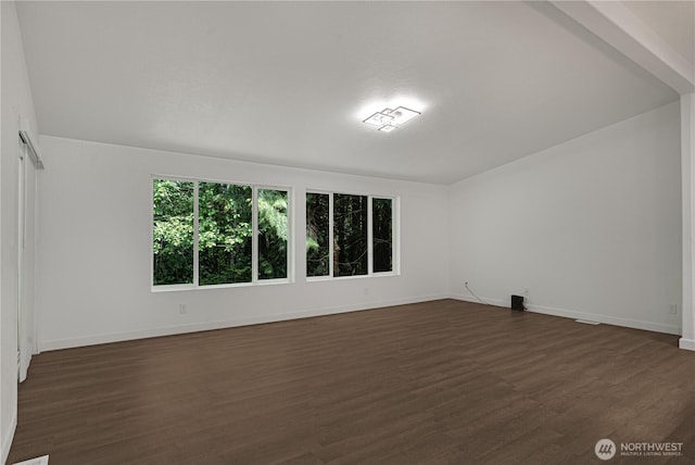 5279 SE Lars Hansen Rd, Port Orchard, WA 98367 - empty room featuring dark wood-style flooring and baseboards