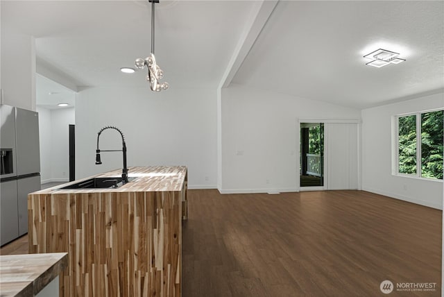 5279 SE Lars Hansen Rd, Port Orchard, WA 98367 - kitchen featuring stainless steel fridge with ice dispenser, butcher block counters, plenty of natural light, vaulted ceiling, and dark wood finished floors