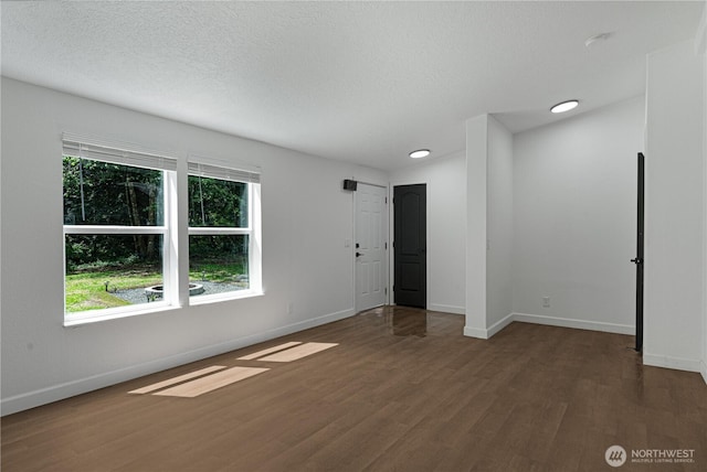 5279 SE Lars Hansen Rd, Port Orchard, WA 98367 - unfurnished room featuring wood finished floors, healthy amount of natural light, recessed lighting, and a textured ceiling