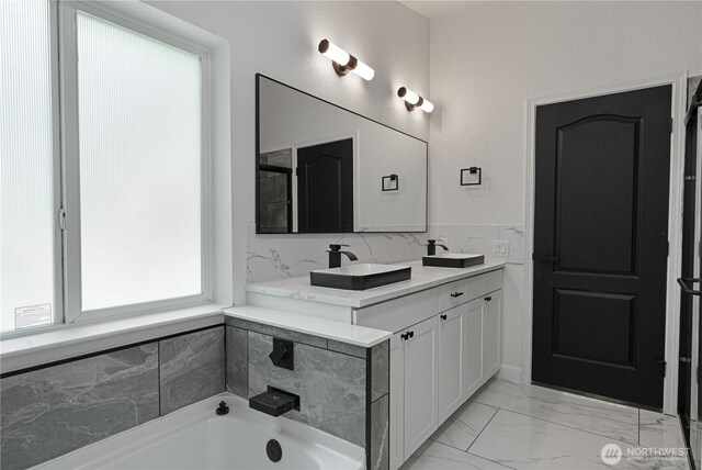 5279 SE Lars Hansen Rd, Port Orchard, WA 98367 - full bath featuring a garden tub, double vanity, and marble finish flooring