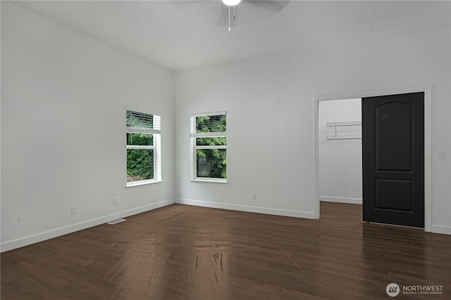 5279 SE Lars Hansen Rd, Port Orchard, WA 98367 - empty room featuring a ceiling fan and dark wood-style floors