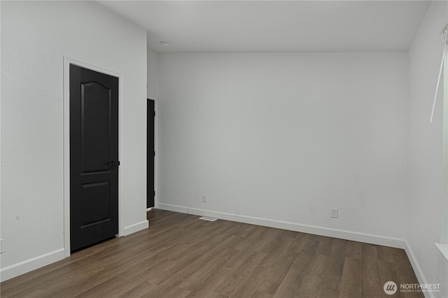 5279 SE Lars Hansen Rd, Port Orchard, WA 98367 - unfurnished room with dark wood finished floors and baseboards