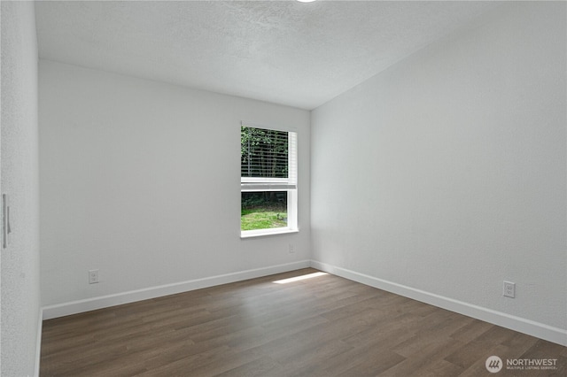 5279 SE Lars Hansen Rd, Port Orchard, WA 98367 - empty room featuring dark wood-style flooring and a textured ceiling