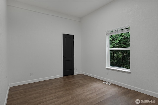 5279 SE Lars Hansen Rd, Port Orchard, WA 98367 - spare room with dark wood finished floors and baseboards