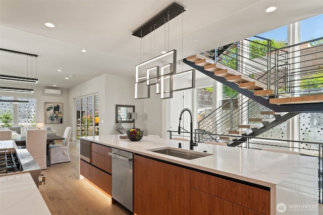 11888 SE 5th St, Bellevue, WA 98005 - kitchen with open floor plan, modern cabinets, appliances with stainless steel finishes, light wood finished floors, and recessed lighting