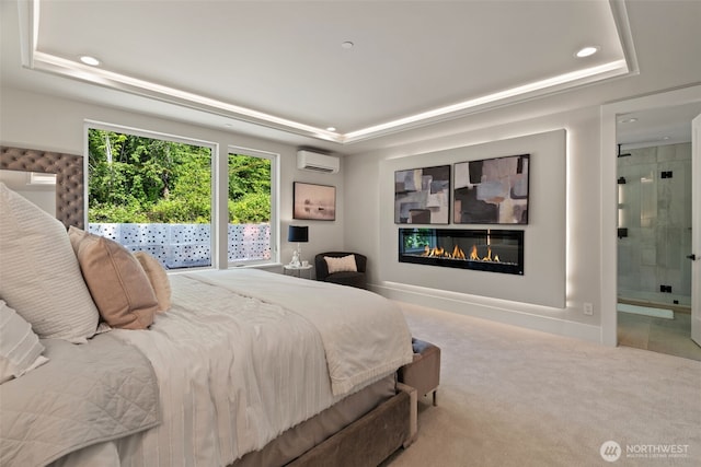11888 SE 5th St, Bellevue, WA 98005 - carpeted bedroom with a raised ceiling, a glass covered fireplace, an AC wall unit, recessed lighting, and ensuite bath