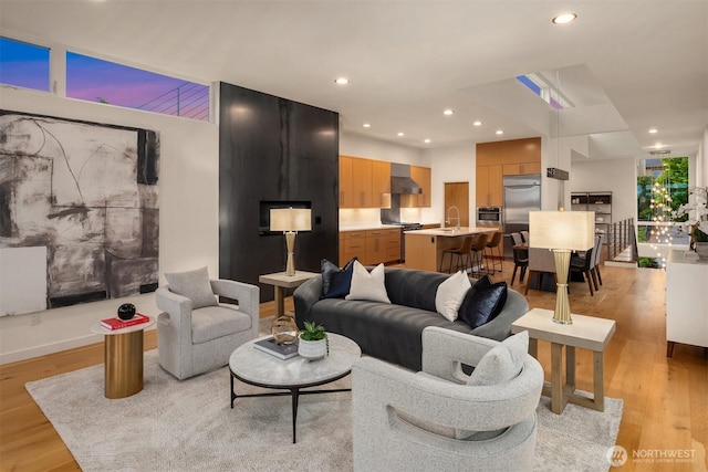 3812 Cascadia Ave S, Seattle, WA 98118 - living area featuring light wood-style floors and recessed lighting