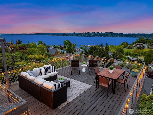 3812 Cascadia Ave S, Seattle, WA 98118 - deck at dusk with a water view, outdoor lounge area, and outdoor dining area
