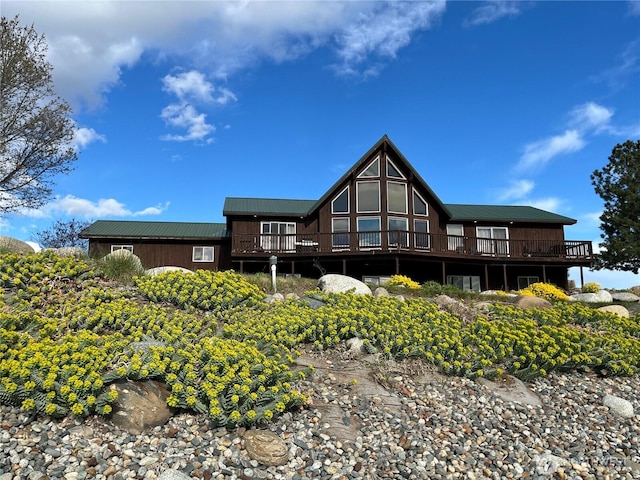 7 Sunset Lakes Rd, Omak, WA 98841 - back of property featuring a deck and a metal roof