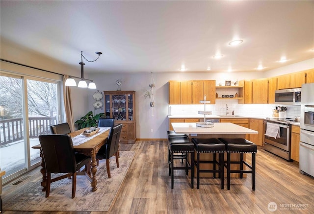 7 Sunset Lakes Rd, Omak, WA 98841 - dining room with light wood finished floors and recessed lighting