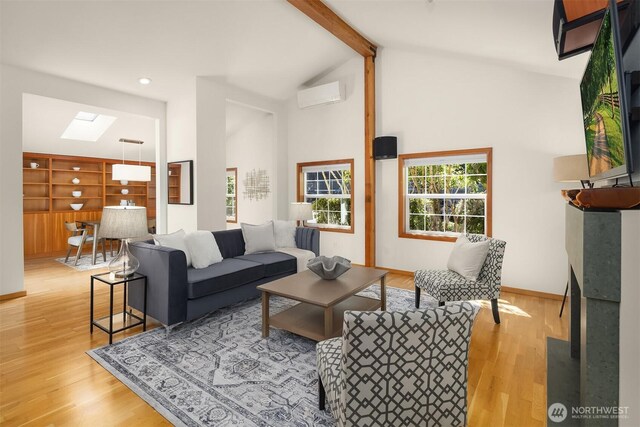 537 30th Ave E, Seattle, WA 98112 - living area with a skylight, beamed ceiling, light wood-style flooring, high vaulted ceiling, and recessed lighting