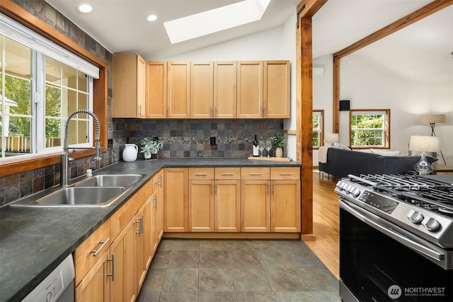 537 30th Ave E, Seattle, WA 98112 - kitchen featuring lofted ceiling, gas stove, tasteful backsplash, a skylight, and dishwasher