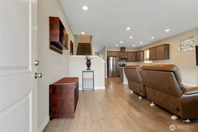 1447 E 48th St, Tacoma, WA 98404 - living area featuring light wood-style floors, recessed lighting, and stairs