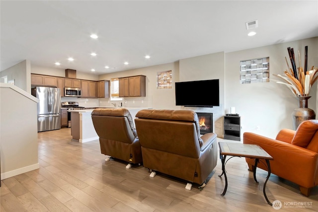 1447 E 48th St, Tacoma, WA 98404 - living room with light wood-style flooring and recessed lighting