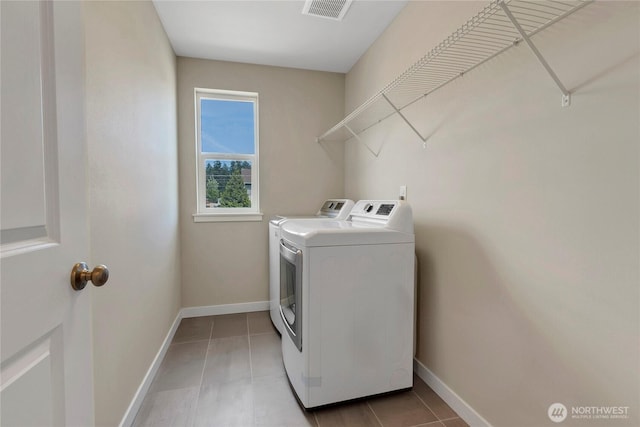 1447 E 48th St, Tacoma, WA 98404 - washroom with independent washer and dryer and light tile patterned floors