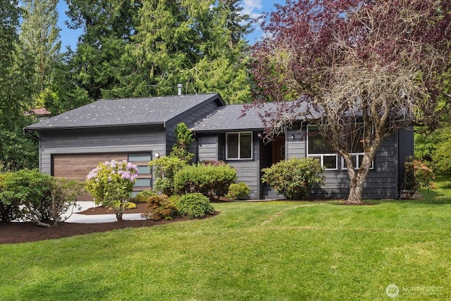 1513 Lowell Ave, Bellingham, WA 98229 - view of front facade featuring a front yard, an attached garage, and roof with shingles