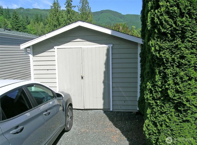 921 Autumn Ln Unit 254, Bellingham, WA 98229 - view of shed with a mountain view and a forest view