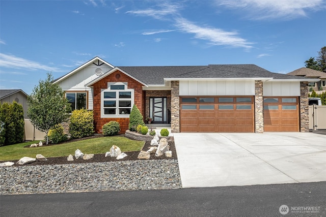 453 Spruce Ct NW, East Wenatchee, WA 98802 - view of front of property with board and batten siding, an attached garage, roof with shingles, and driveway