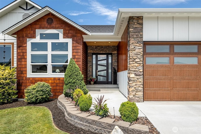 453 Spruce Ct NW, East Wenatchee, WA 98802 - view of front of property with stone siding, a garage, and board and batten siding