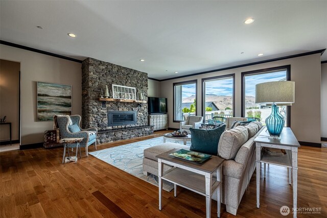 453 Spruce Ct NW, East Wenatchee, WA 98802 - living area featuring ornamental molding, a fireplace, wood finished floors, and recessed lighting