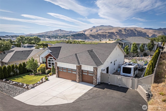 453 Spruce Ct NW, East Wenatchee, WA 98802 - view of front of property with a gate, board and batten siding, a garage, driveway, and a shingled roof