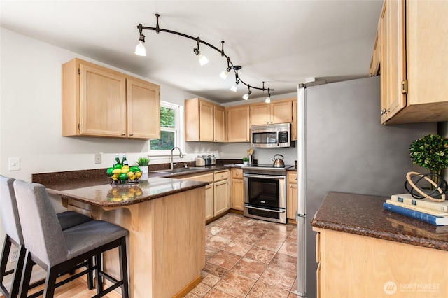 19508 23rd Ave NE, Shoreline, WA 98155 - kitchen featuring stainless steel appliances, light brown cabinetry, a peninsula, and dark stone counters