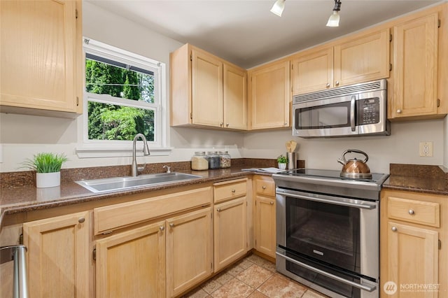 19508 23rd Ave NE, Shoreline, WA 98155 - kitchen featuring stainless steel appliances, light brown cabinetry, and light tile patterned flooring