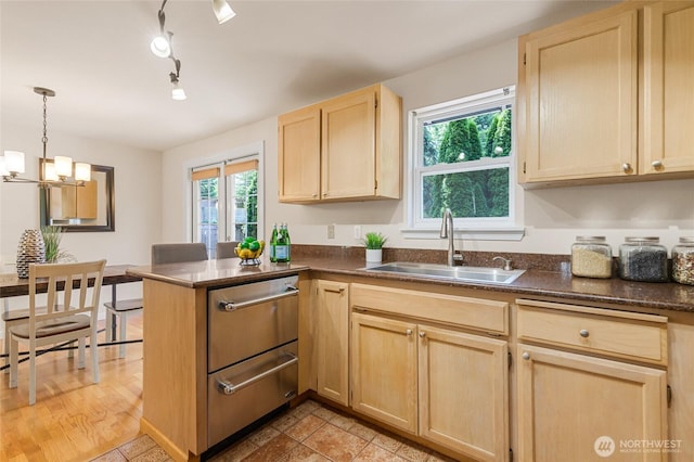 19508 23rd Ave NE, Shoreline, WA 98155 - kitchen with light brown cabinets, a peninsula, a chandelier, hanging light fixtures, and a warming drawer