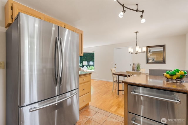 19508 23rd Ave NE, Shoreline, WA 98155 - kitchen featuring stainless steel appliances, light brown cabinetry, light tile patterned flooring, and a chandelier